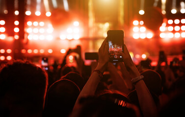 Taking photo or video content for social networks at the concert, Mobile phone on music show.