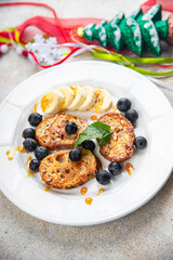 pancake day sweet toast fruit bread fried in egg holiday breakfast Christmas sweet dessert holiday treat new year and christmas celebration meal food snack on the table copy space food 