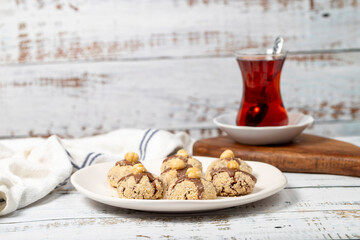 Hazelnut cookies. Chocolate and hazelnut cookies on a white wooden background. patisserie products