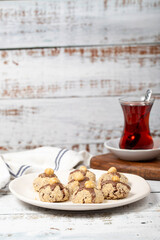 Hazelnut cookies. Chocolate and hazelnut cookies on a white wooden background. patisserie products. Close up