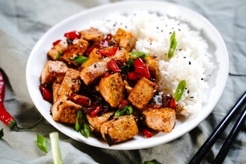  Szechuan tofu stir fry served with jasmin rice, selective focus