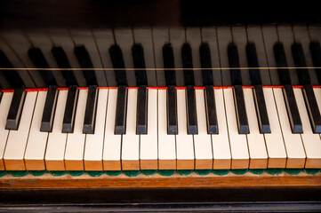 piano keys close up, pen classical piano showing the strings internal mechanisms