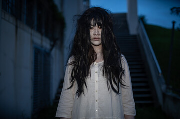 Portrait of asian woman make up ghost face with blood,Horror scene,Scary background,Halloween...