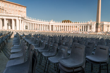 Photograph of auditorium with empty chairs. Mass in the Vatican. Saint Peter's Square. Event....