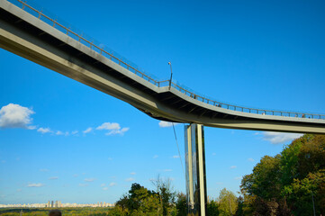 Low angle view of New Pedestrian Bridge (also called Klitschko Bridge) against blue sky. It is one of the city's best known landmarks. Travel and tourism concept