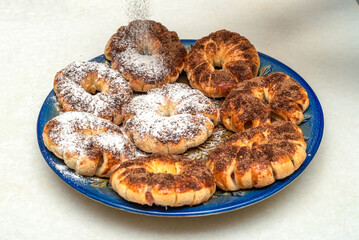 Dust baked apple rings in cinnamon batter with powdered sugar.