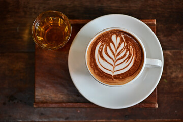 high angle view of coffee cup on wood grain table Drinking Concept: Hot Coffee, Latte, Espresso, Cappuccino