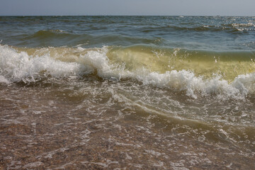 Sea view. Big and stormy waves of the Black Sea on a sunny day. Small depth of field