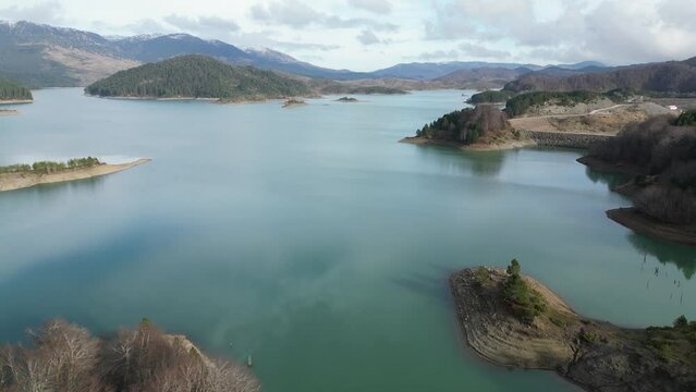 Aerial flight over the lake of Aoou in Ioannina near Metsovo on a beautiful winter day, Epirus, 