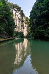 Water reflection of high towering cliff in Wulong krast national geology park, Chongqing, China