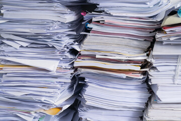 A stack of used papers or old documents was well packed and kept outside office, waiting for...