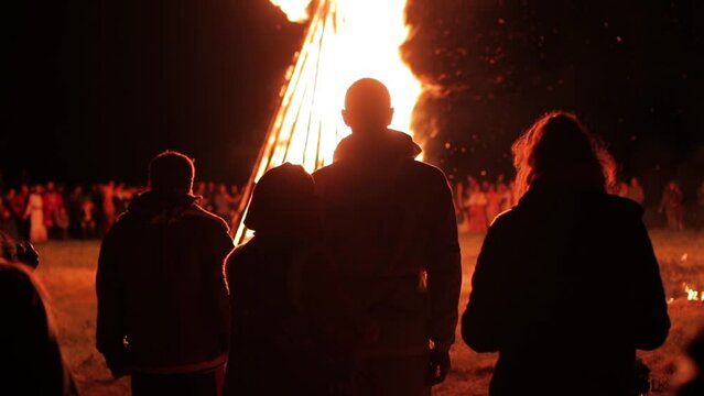 People near the bonfire celebrate the feast of Ivan Kupala Day or Kupala Night - folk festival of the Eastern Slavs.