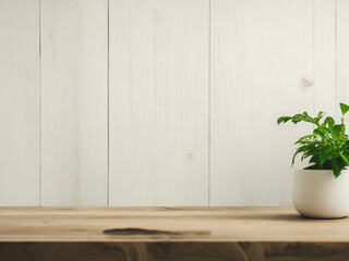 Wooden table in a room with blurred white wall 