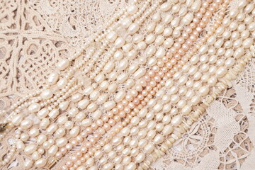 Pearls and crocheted Doilies vintage background 