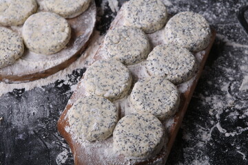 photo this homemade poppy seed cheesecake, photography shot, sits on a rustic wooden board. Its appetising a delectable dessert, brimming with sweet culinary allure.