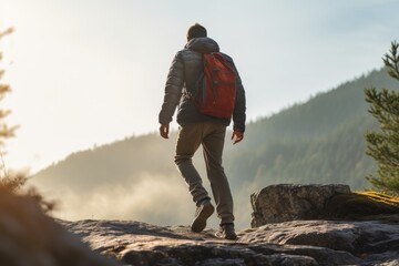 Obraz premium People hiking and trekking on the top of the mountain with sunlight and blue sky background.