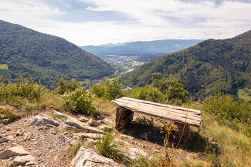 Mountain landscape with green forests and blue summer sky