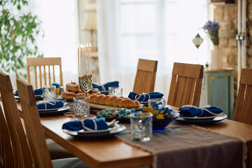 Hanukkah table setting ready for family meal at home.