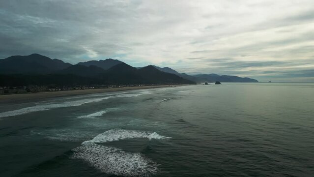 Aerial wide shot of coastal town Cannon Beach, Oregon