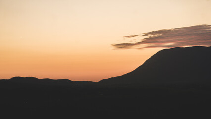 Mountain landscape with the silhouette of the mountains at sunset