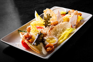 Caesar salad with croutons, cheese, eggs, tomatoes and grilled chicken