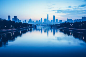 Landscape of bridge, river and city in cold blue morning light