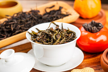 Brewing Chinese tea in ceramic gaiwan during the tea ceremony close-up.