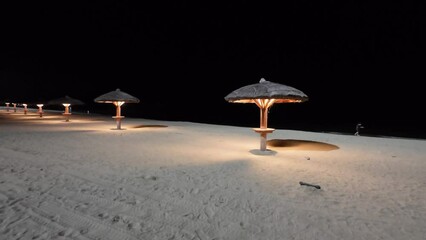 Parasol at the beach at night