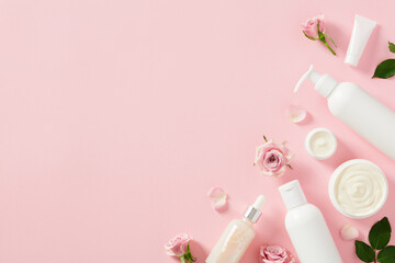 Cosmetic bottles, jars of cream, serum with rose buds and petals on light pink background. Skin care concept.