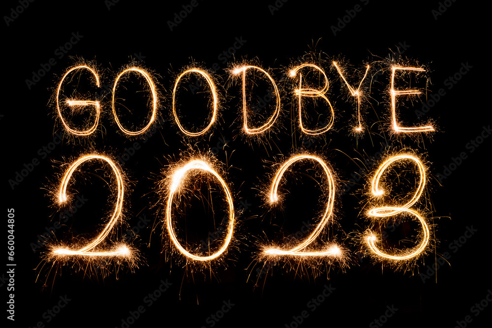 Wall mural Happy New Year 2024. Sparkling burning text Happy New Year 2024 isolated on black background.