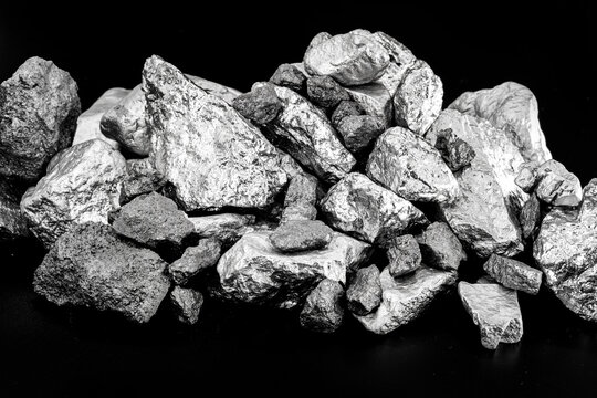 several rough stones, silver, manganese, tin, chrome and platinum. Mining concept, industrial material.