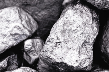 Raw manganese. Manganese stone isolated on black background.