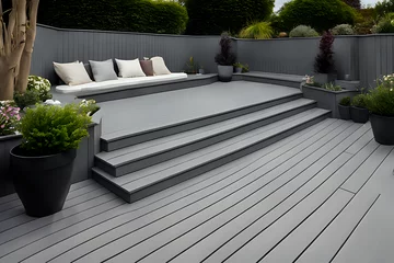 Fotobehang Composite decking in ash grey with three levels deck lights, minimalist sofa and ideal for a landscape gardener © indofootage