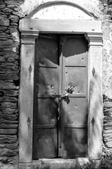 Stone masonry structure, old type wooden door detail.