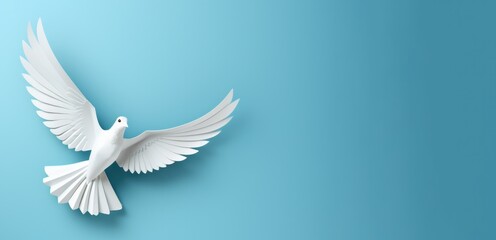 Fototapeta premium Banner featuring a white paper origami bird against a blue backdrop