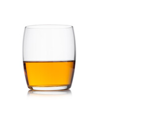 Scotch whiskey in crystal elegant glass on white background.
