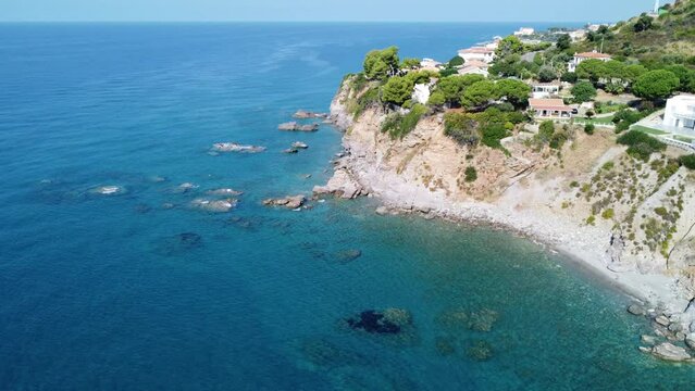 Beautiful aerial shot of Cittadella del Capo, near Bonifati, Calabria, province of Cosenza. In the video Cala Del Faro with its typical cliffs on the turquoise sea.