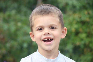 a boy without a tooth. Selective focus.
