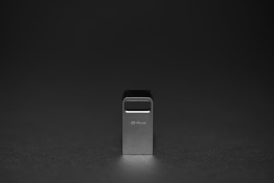 Macro photography of metal USB stick isolated on black background