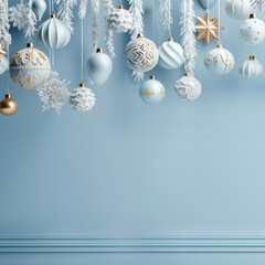 Pastel blue monochrome Christmas card with hanging Xmas decorations and copy space.
