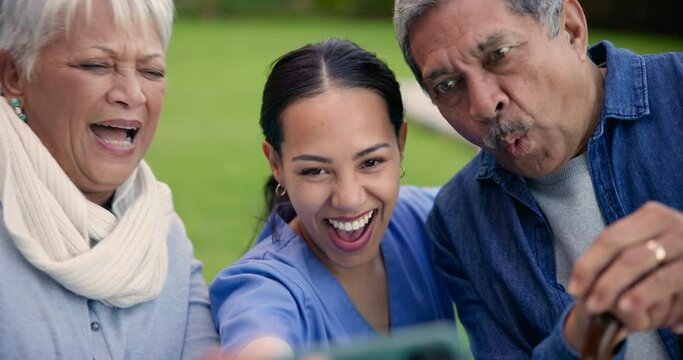 Nurse, senior people and funny selfie with peace sign language, memory or laugh in nursing home garden. Old couple, caregiver and photography for profile picture, social media update or kiss on vlog