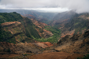 Canyon Lookout is a poplar area for visitors to Kauai's colorful canyon. kauai, hawaii - sep 2022