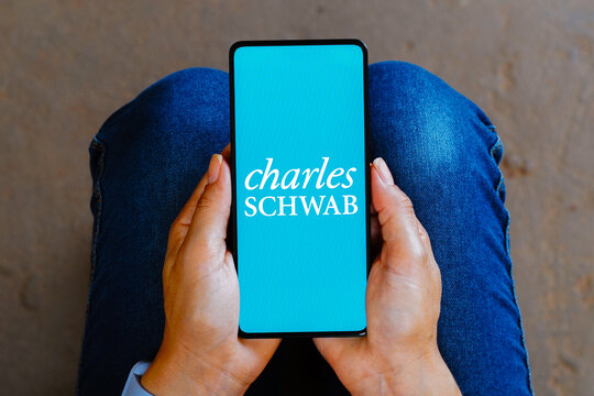 October 10, 2023, Brazil. In this photo illustration, the Charles Schwab logo is displayed on a smartphone screen.