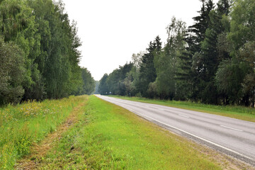 Automobile highway, which goes to the distance in the north of Russia