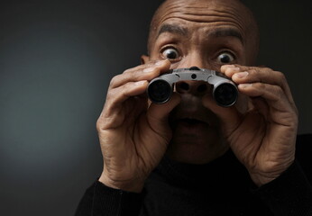 man looking through binoculars look ahead for the future with people stock photo