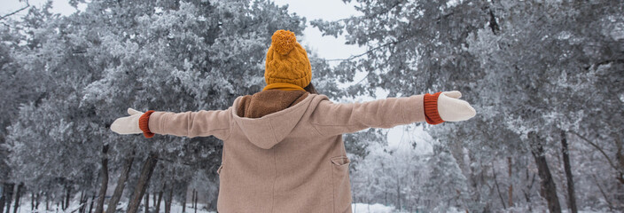 happy woman in snowy park