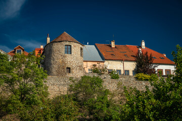 Houses near old square in sunny hot autumn day in Kadan