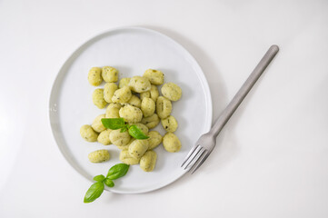 Italian gnocchi. Traditional Italian food. Handmade potato balls with parmesan and basil. Food for vegetarians and lovers of Italian typical cuisine. homemade pasta . High quality