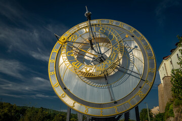 Astronomical clock near old square in sunny hot autumn day in Kadan