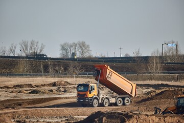 Road construction truck hauling gravel